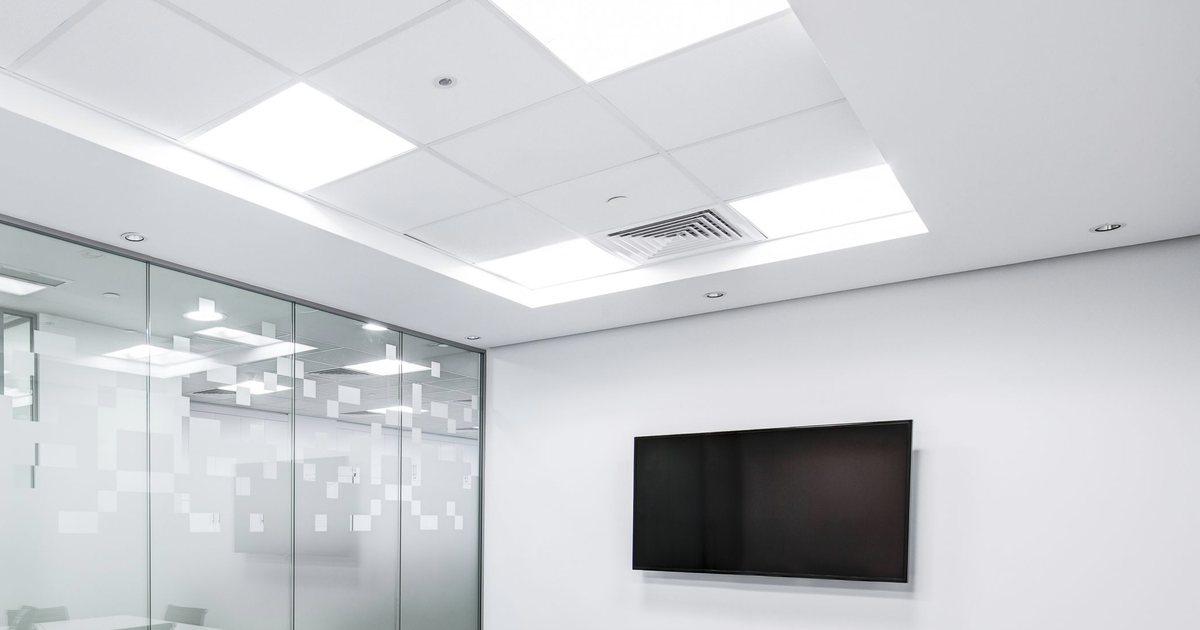 Meeting room with a glass wall and a wall-mounted screen